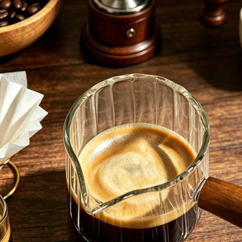 Close-up of 180Ml Glass Espresso Shot Cups For Ninja Espresso Machines With Clear Graduation Scale on wooden surface