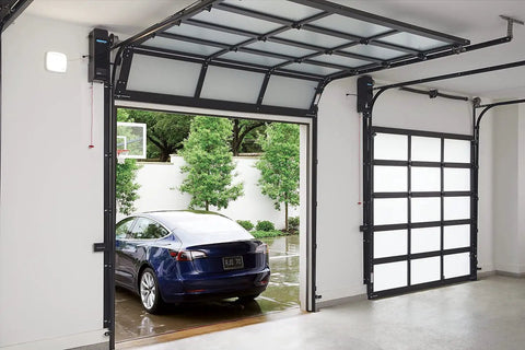 Slick Wall Mounted Smart Garage Door Opener With Rock Solid Battery Backup Ultra Silent Direct Drive Motor in garage.