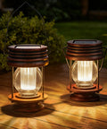 Two Pack Solar Lanterns Outdoor Lighting For Patio And Garden with retro warm glow on wooden table at night scene.
