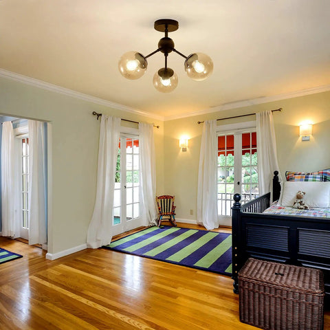Three Light Glass Globe Chandelier Matte Black Nordic Style Semi Flush Mount Ceiling Fixture in a cozy bedroom setting.