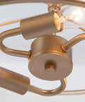 Close-up of Gold Drum Pendant Chandelier Light Fixture With White Fabric Shade, showing bulb sockets and gold finish detail