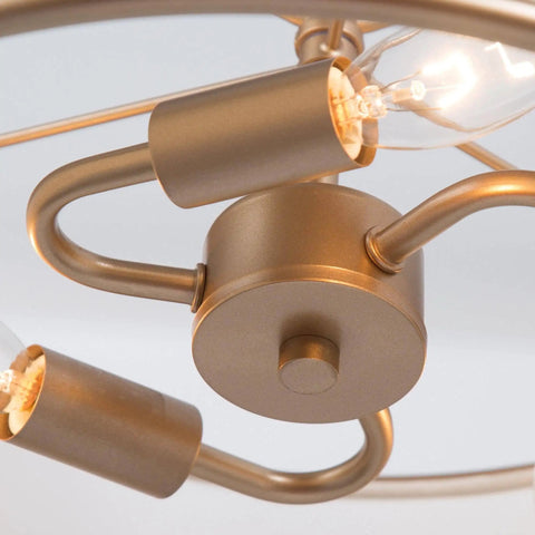 Close-up of Gold Drum Pendant Chandelier Light Fixture With White Fabric Shade, showing bulb sockets and gold finish detail