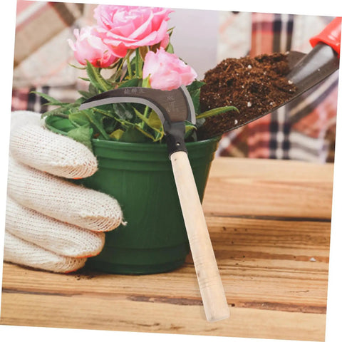 Portable Manganese Sickle For Garden Weeding And Harvesting With Ergonomic Handle next to potted flowers