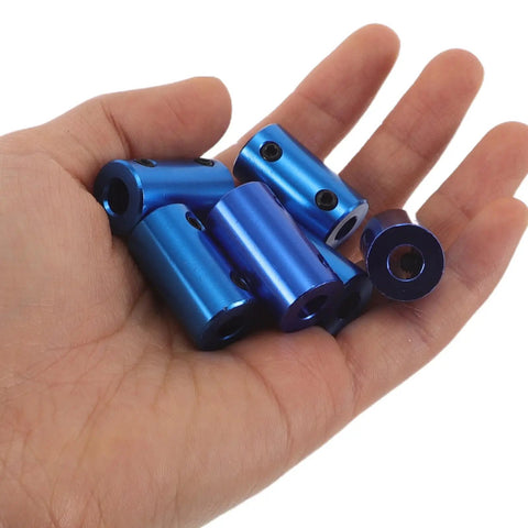 Ten Piece Blue Aluminum Motor Shaft Coupling Connectors 6mm Fit For 3D Printers And CNC Machines held in hand.