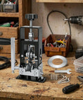 Powerful Drill Powered Electric Wire Stripping Machine For Copper Scrap Recyclers Automatic Cable Peeling Tool Remove Insulation Fast With Hand Crank Backup High Efficiency Workshop Essential Gear on a wooden workbench.