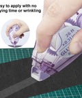 Hand using Double Sided Scrapbooking Tape Runner 4 Pack, 26 Feet By 0.31 Inch, Great For Crafts And Junk Journals, Glue Tape For Photos And Card Making.