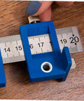 Straight Shot Precision Adjustable Woodworking Jig For Cabinet Hardware Portable Hole Punch Locator, blue measuring tool with slider.