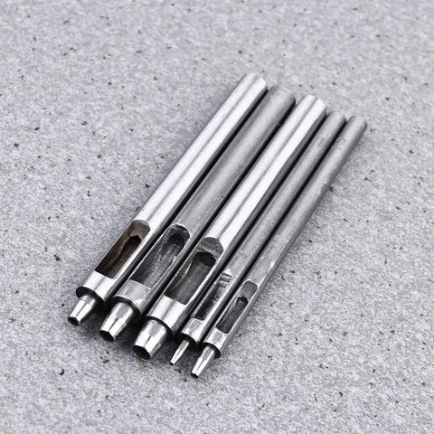 Leather Hole Puncher Set Five Piece With Steel Hollow Round Punch Tools 1-5mm arranged on a surface