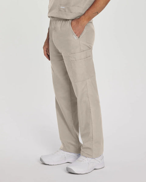 Side view of Relaxed Fit 7 Pocket Elastic Cargo Scrub Pants For Men With Stretch Waistband And Drawstring, showing beige color and fit.