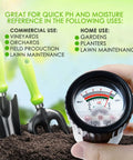 Hand holding All-In-One Soil pH And Moisture Meter for garden use, with gardening tools on soil.