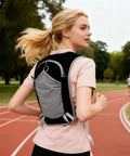 Woman running with Lightweight Hydration Backpack For Outdoor Adventures With Waterproof Phone Pocket And Large Multi Pocket Layout
