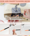 Close-up of using complete 14 piece sewing machine cleaning kit with tweezers double headed brush for quick repairs and deep cleaning.
