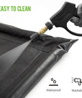 Close-up of Containment Mat For Garage Floor 7 Foot 9 Inch By 16 Foot Non Slip Heavy Duty Waterproof Car Floor Protector being cleaned with water spray.