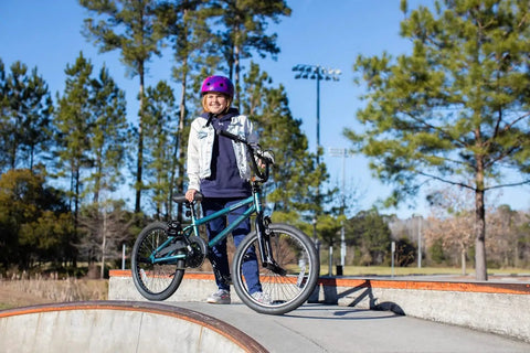 Child at skate park with Tony Hawk 720 20 Inch BMX Bike Built For Speed And Durability, Perfect For Kids And Teens Learning Tricks