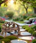 Set Of 2 Miniature Resin Garden Benches For Fairy Village Dollhouse Decor in a vibrant fairy garden setting with flowers and stones.