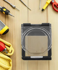 Square Power Button Protective Cover With Self Adhesive Backing And Spring Loaded Design For Engine Start And Industrial Control Panels Made From Durable PC Material Easy To Open And Close Prevents Accidental Presses And Keeps Your Equipment Safe. transparent square cover with spring hinge and adhesive backing on a control panel