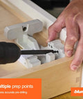 Precision drilling template for concealed undermount drawer runners that simplifies installation, delivering accurate rear-hook and locking-screw hole alignment for fast, tidy, professional drawer assembly being used in woodwork project.