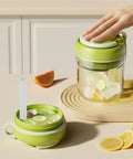 Hand pressing lid of 2 In 1 Ice Bottle Portable Ice Maker Hydration Gear with Leakproof Seal on table with citrus wedges