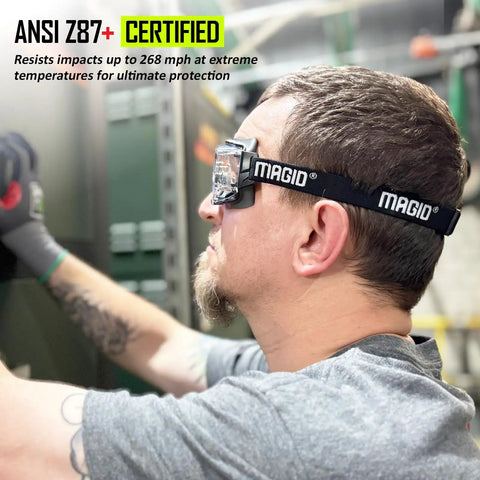 Clear Anti Fog Safety Goggles With Over The Glasses Fit And Ansi Z87 Plus Impact Certified Protection For Hardcore Shop Tasks And Industrial Job Sites 36 Pair worn by a man working in a shop environment.