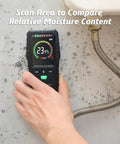 Pinless Moisture Meter For Wood And Walls With Four Modes Softwood Hardwood Wall Masonry Noninvasive Moisture Detection Delivers Fast Accurate Readings For DIYers Builders Home Inspectors And Renovation Projects. Handheld meter scanning a damp wall near a hose, 19mm