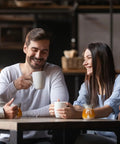 Friends enjoying coffee with 8 Pack 4 Oz Glass Creamer Pitchers Set Clear Milk Pourers on table