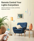 Living room with blue chair, remote control in hand, Wireless Remote Light Socket Kit With Three E26 E27 Sockets No Wiring Needed