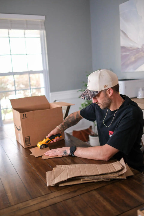 Man using Beast Cordless Scissors For Cardboard And Box Cutting Power Cutter With Rechargeable 4V Battery indoors