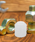 150 Pcs Plastic Dowel Inserts for Cabinet Doors, DIY Friendly Hinge Dowels, white plastic parts shown among metal tools