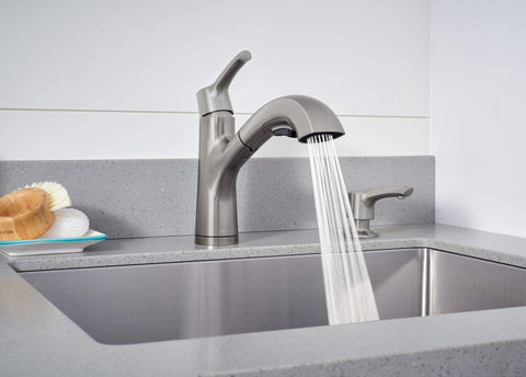 Parkwood Single Handle Pullout Kitchen Faucet With Dual Sprayer Aerated Stream Or Spray Stainless Finish ADA Compliant 120 Degree Swivel Spout Fits Single Hole Install Optional Deck Plate RP100681SS flowing water into sink
