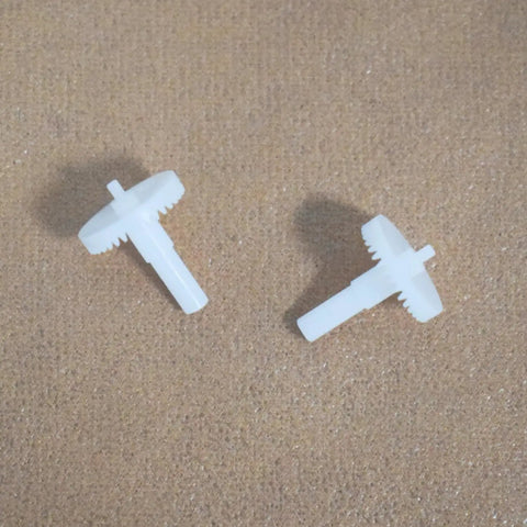 36 Tooth Large Gear And 7 Tooth Pinion Gear Set For Four Axis RC Quadcopters on sand-colored background