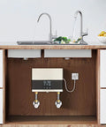 Slick 4000W Tankless Mini Electric Water Heater Featuring Constant Temperature Technology And Convenient Wireless Remote Control Plus Badass Abs Design For Quick Daily Use installed under kitchen sink with faucets.