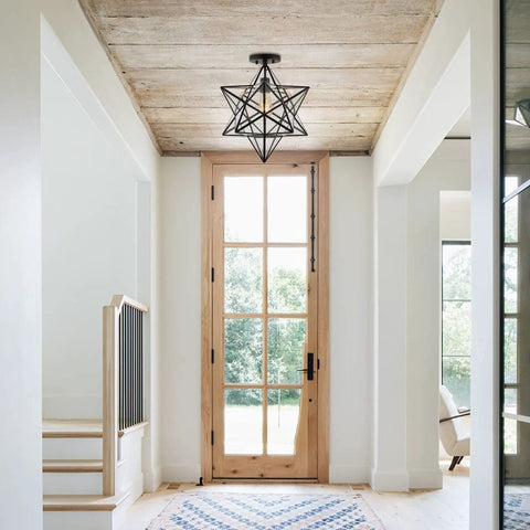 Black 14.5 Inch Moravian Star Ceiling Light 1 Light Semi Flush Mount Iron And Glass Farmhouse Boho Lantern For Hallway And Bedroom UL Listed LED Bulb Included installed in a bright modern hallway with wooden door and rug
