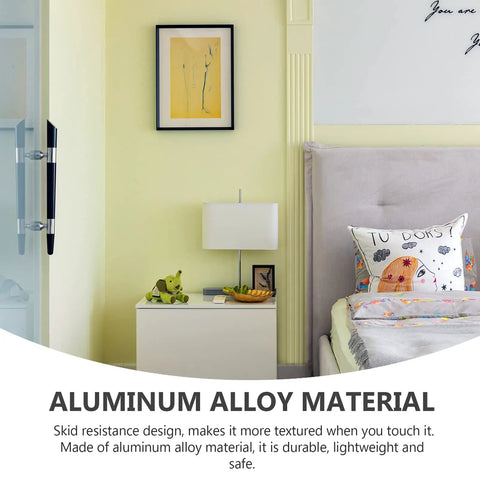 Bedroom with yellow wall, white nightstand, lamp, and decorative pillows on bed. Aluminum alloy material emphasis.