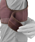 Adjustable Rifle And Shotgun Field Shield Recoil Pad With Leather Shirt Vest, shown secure on shoulder with adjustable strap