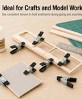 Straight Up Kicking 40 Pack Mini Spring Clamps Heavy Duty Nickel Plated Steel Clips holding wood during craft assembly.