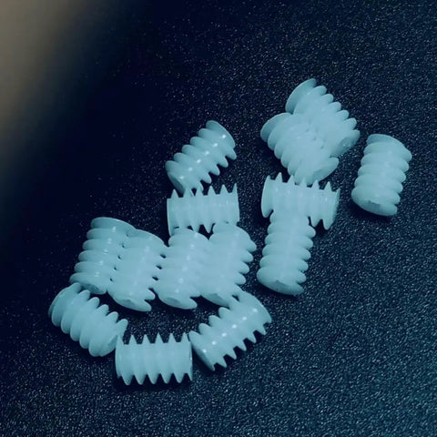 10 Pack 0.3 Module Plastic Mini Worm Gears Kit, 0.65mm Inner Hole, 3.5 By 5mm Size on dark surface