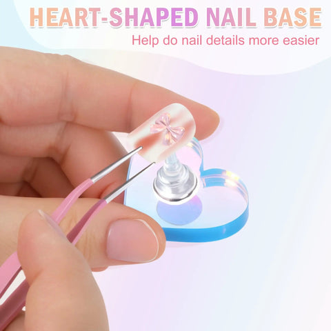 Heart Shaped Magnetic Nail Stand Set For Press Ons, acrylic nail on heart-shaped base with tweezers in use.