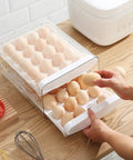 Clear Plastic Egg Holder With Two Layer 40 Egg Capacity Drawer Style Fridge Storage Box For Fresh Eggs being accessed