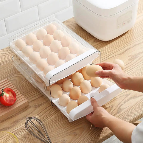 Clear Plastic Egg Holder With Two Layer 40 Egg Capacity Drawer Style Fridge Storage Box For Fresh Eggs being accessed