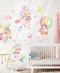 Whimsical Rainbow Unicorn Wall Decals Set With Balloons, Moon, Clouds And Stars for nursery decor on white wall above crib