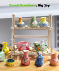 Alldeer mini pottery wheel kit on a wooden stand with colorful glazed ceramic vases and bowls