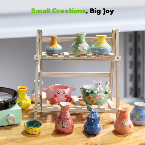 Alldeer mini pottery wheel kit on a wooden stand with colorful glazed ceramic vases and bowls