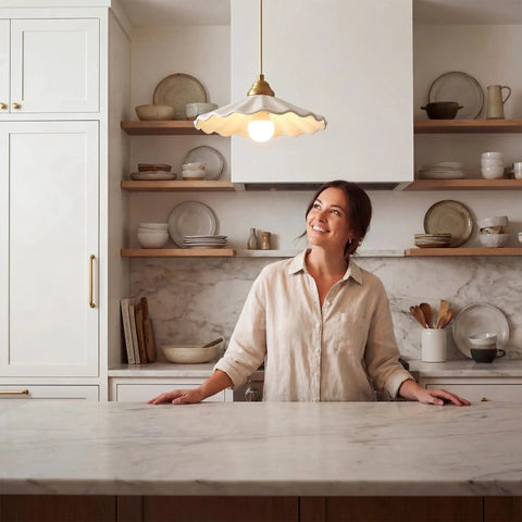 Premium White Scalloped Ceramic Pendant Light Adding Sweet Vintage Charm To Kitchen Islands, hung over a marble countertop.
