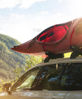 Car with kayak secured by Heavy Duty Cambuckle Straps 1 Inch By 15 Feet 500 Lbs Working Load 1500 Lbs Break Strength Rubber Coated Hooks