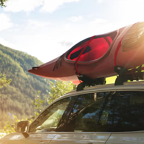 Car with kayak secured by Heavy Duty Cambuckle Straps 1 Inch By 15 Feet 500 Lbs Working Load 1500 Lbs Break Strength Rubber Coated Hooks