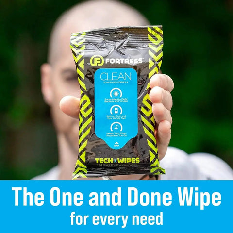 Person holding To Go Tech Wipes 25 Count Skin Safe Electronics Cleaning Wipes For Screens Phones Tablets Laptops Keyboards Monitors Travel Size Grab And Go Home Office Ready
