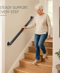 Dead Tight Six Foot Industrial Pipe Hand Rails For Indoor Stairs And Outdoor Decks Featuring Sleek Matte Black Finish with woman using hand rail on stairs.