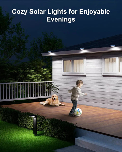 Child playing on a deck at night illuminated by Four Pack White Solar Powered Gutter Lights Outdoor Decorative Waterproof 12 LEDs Yard Lamps.