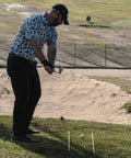 Golfer using Golf Alignment Sticks 45 Inch Fiberglass Rods Training Aid Set of 2 White on course for swing accuracy.