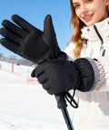 Black Warm Waterproof Winter Ski Gloves For Men And Women With All Day Warmth, windproof snow gloves being worn on a snowy day